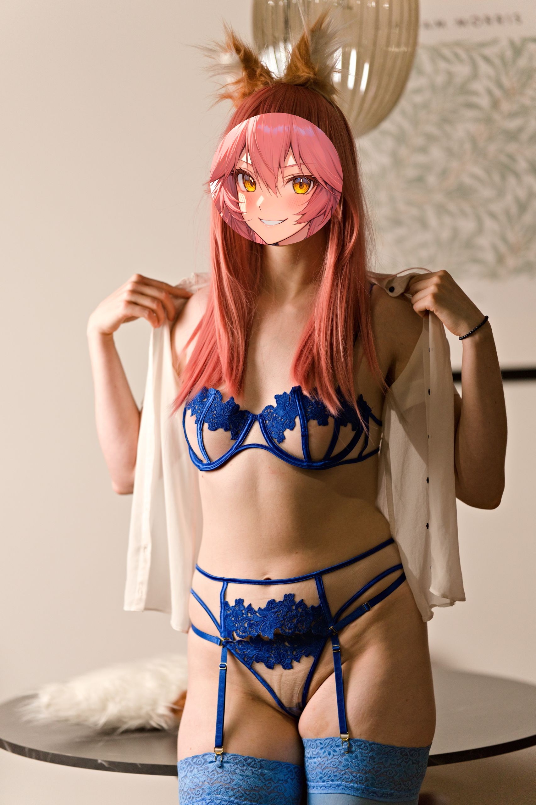 Shizuka Kawa cosplaying as Tamamo-no-mae from Fate/Grand Order dressed in a blue lace bra and matching G-string with a sheer white shirt and blue thigh-high stockings attached to a garter belt. She stands facing the camera, holding her shirt open to reveal her chest.